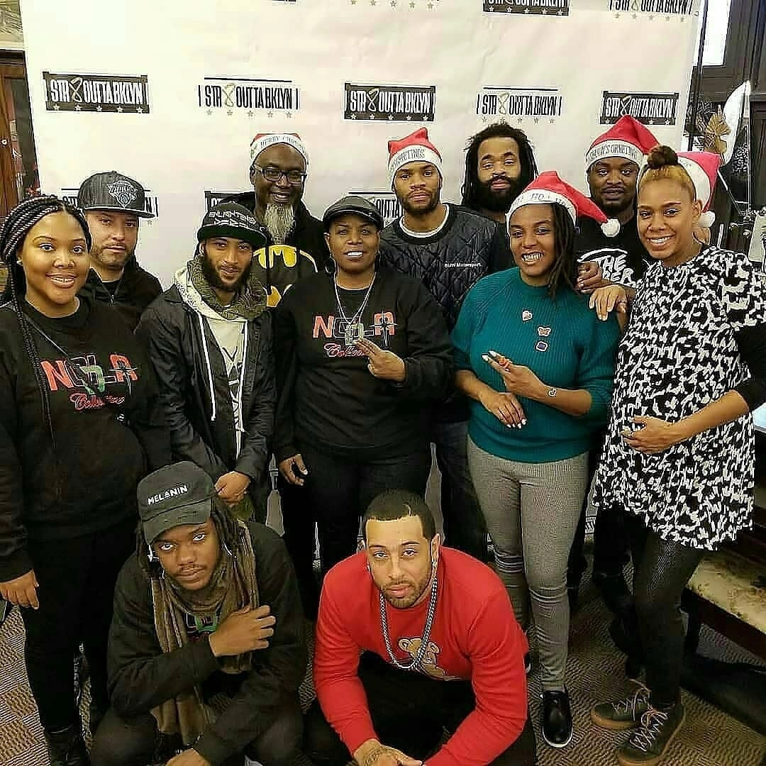 Johari James and volunteers for Str8OuttaBklyn’s Holiday Golden Giveback Event at Stone Ave Library in Brownsville, 2017